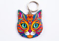 ai image of a multicoloured, vibrant cat's head keyring